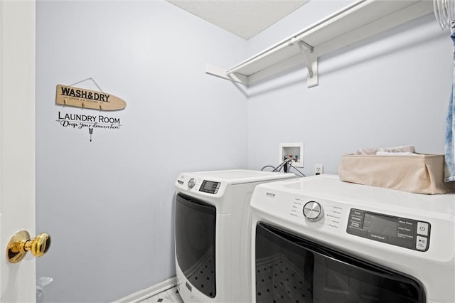 22116 W 51st St, Shawnee, KS 66226 - laundry room featuring washing machine and clothes dryer and baseboards