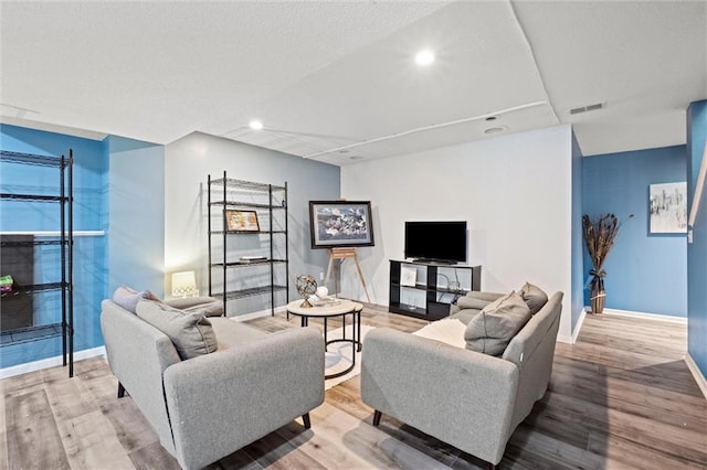 22116 W 51st St, Shawnee, KS 66226 - living room featuring wood finished floors and recessed lighting