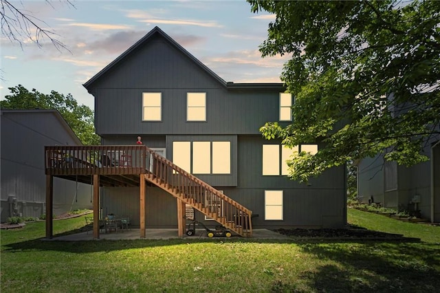 22116 W 51st St, Shawnee, KS 66226 - rear view of property with stairway, a deck, a patio area, and a lawn