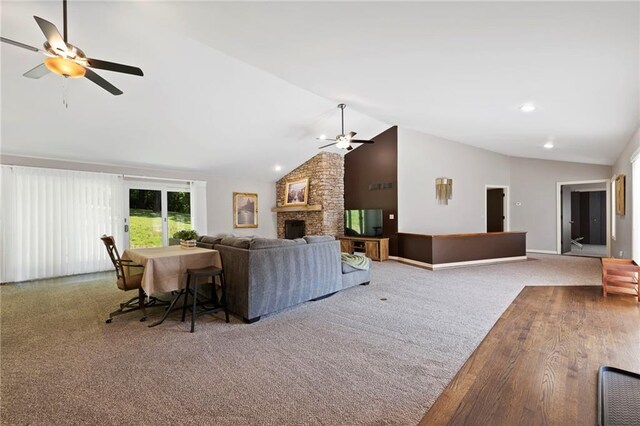 4813 NW Northwood Rd, Riverside, MO 64150 - living area with a ceiling fan, vaulted ceiling, a fireplace, and carpet