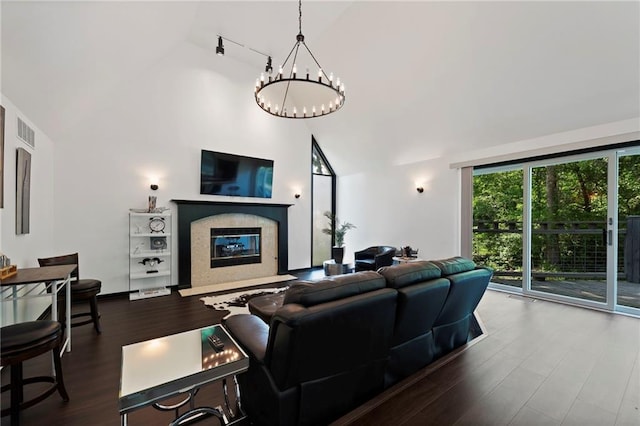 4813 NW Northwood Rd, Riverside, MO 64150 - living room with high vaulted ceiling, a chandelier, a premium fireplace, and wood finished floors