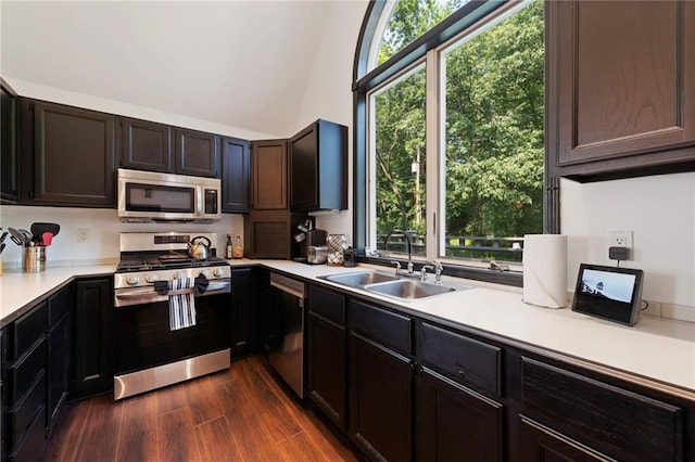 4813 NW Northwood Rd, Riverside, MO 64150 - kitchen featuring appliances with stainless steel finishes, light countertops, healthy amount of natural light, and dark wood-type flooring