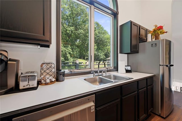 4813 NW Northwood Rd, Riverside, MO 64150 - kitchen featuring stainless steel appliances, healthy amount of natural light, and light countertops