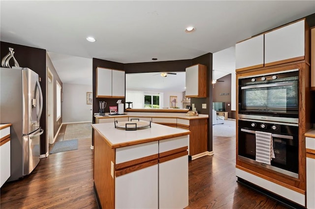 4813 NW Northwood Rd, Riverside, MO 64150 - kitchen featuring stainless steel refrigerator with ice dispenser, double wall oven, light countertops, white cabinets, and recessed lighting