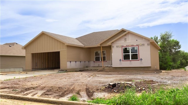 1105 Charles St, Knob Noster, MO 65336 - property in mid-construction featuring an attached garage and a shingled roof