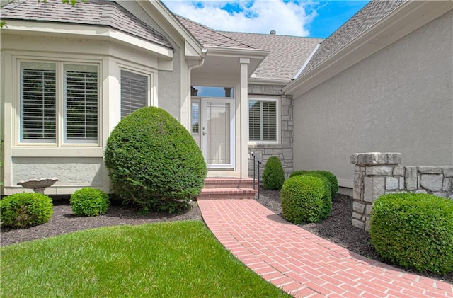6306 W 128th St, Overland Park, KS 66209 - doorway to property with stucco siding, stone siding, and roof with shingles