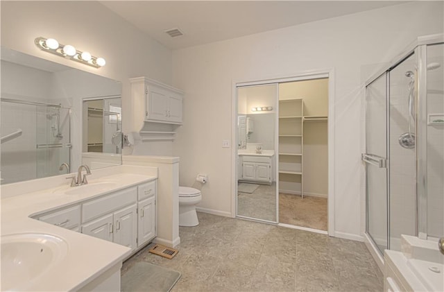 6306 W 128th St, Overland Park, KS 66209 - full bath featuring vanity, a shower stall, and a spacious closet
