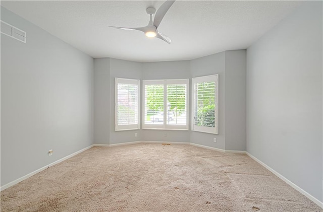 6306 W 128th St, Overland Park, KS 66209 - carpeted spare room with ceiling fan and baseboards