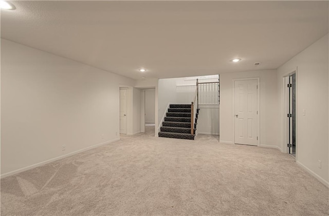 6306 W 128th St, Overland Park, KS 66209 - finished basement with light carpet, recessed lighting, stairs, and a barn door