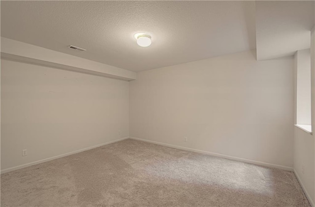 6306 W 128th St, Overland Park, KS 66209 - carpeted empty room with a textured ceiling and baseboards