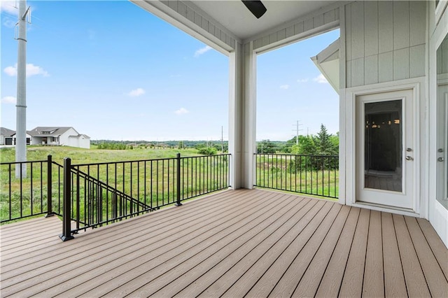 15837 El Monte St, Overland Park, KS 66224 - deck featuring ceiling fan and a yard