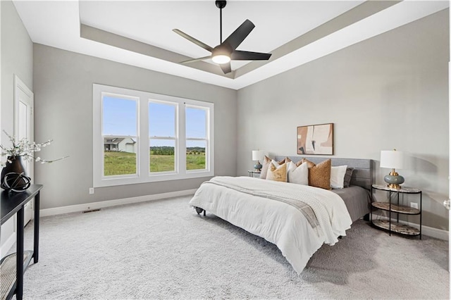 15837 El Monte St, Overland Park, KS 66224 - carpeted bedroom featuring a raised ceiling and ceiling fan
