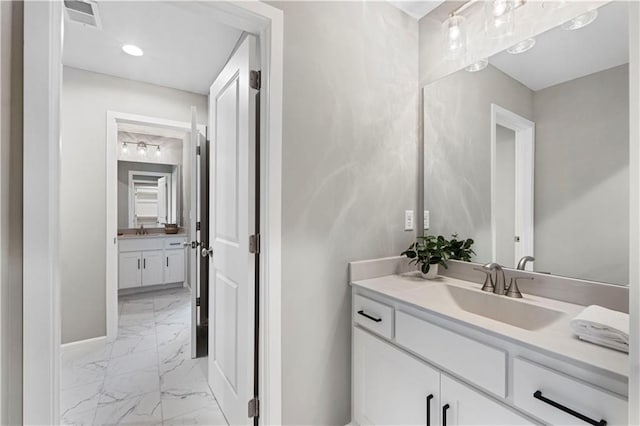 15837 El Monte St, Overland Park, KS 66224 - bathroom with marble finish flooring and vanity