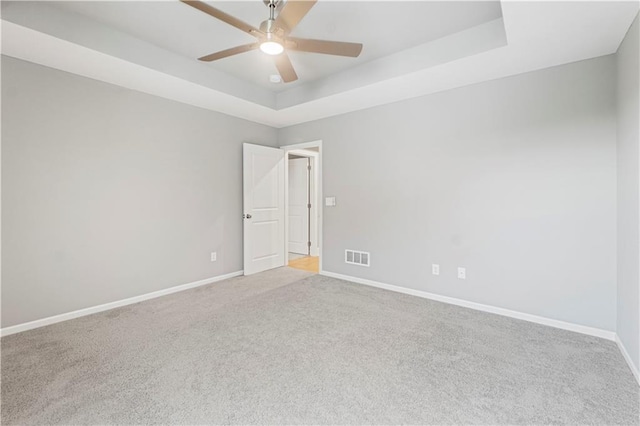 15837 El Monte St, Overland Park, KS 66224 - carpeted spare room featuring a raised ceiling and ceiling fan