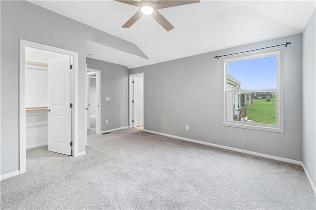 15837 El Monte St, Overland Park, KS 66224 - unfurnished bedroom with carpet, vaulted ceiling, a spacious closet, a closet, and ceiling fan