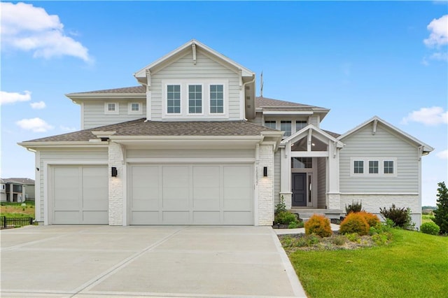 15837 El Monte St, Overland Park, KS 66224 - view of front facade featuring concrete driveway, a garage, a front yard, and a shingled roof