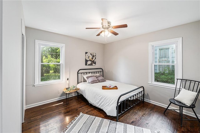 9023 E 74th Ter, Raytown, MO 64133 - bedroom with wood finished floors and a ceiling fan