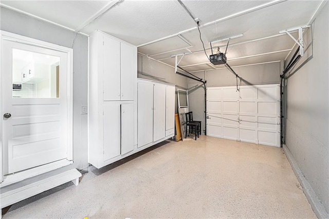 9023 E 74th Ter, Raytown, MO 64133 - garage featuring a garage door opener