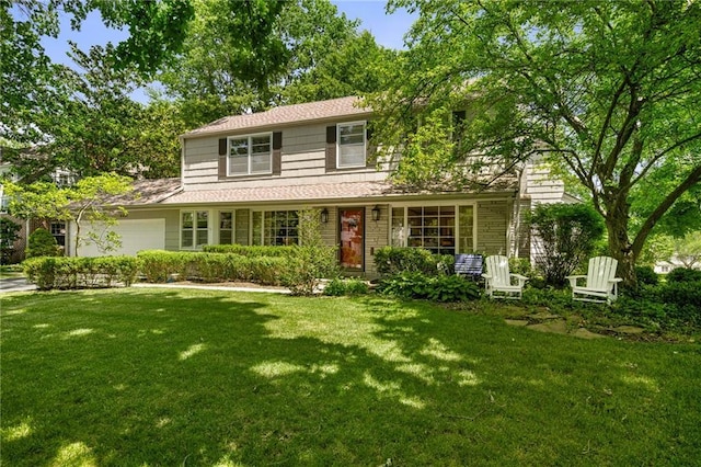 6451 Sagamore Rd, Mission Hills, KS 66208 - traditional-style home with a front yard and a garage