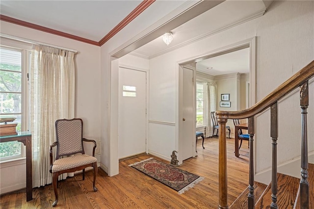 6451 Sagamore Rd, Mission Hills, KS 66208 - entryway with wood finished floors, stairway, and crown molding