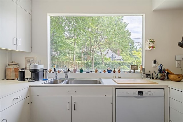 6451 Sagamore Rd, Mission Hills, KS 66208 - kitchen with dishwasher, light countertops, white cabinets, and healthy amount of natural light