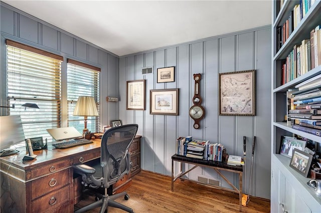 6451 Sagamore Rd, Mission Hills, KS 66208 - home office with wood finished floors and a decorative wall