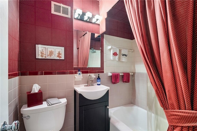 6451 Sagamore Rd, Mission Hills, KS 66208 - full bath with tile walls, vanity, and shower / bath combo