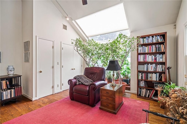 6451 Sagamore Rd, Mission Hills, KS 66208 - sitting room featuring wood finished floors and lofted ceiling