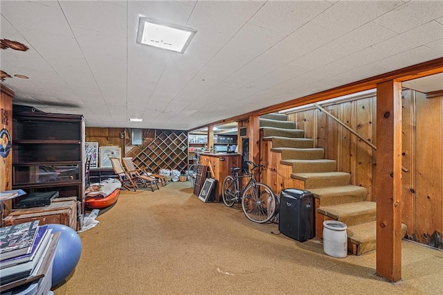 6451 Sagamore Rd, Mission Hills, KS 66208 - finished below grade area featuring carpet, wood walls, and stairway
