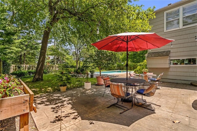 6451 Sagamore Rd, Mission Hills, KS 66208 - view of patio / terrace with an outdoor pool and outdoor dining space