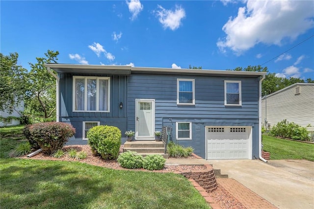 16100 E Elm St, Independence, MO 64050 - raised ranch with driveway, an attached garage, and a front yard