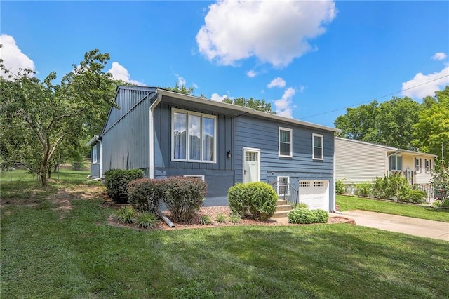 16100 E Elm St, Independence, MO 64050 - raised ranch featuring driveway, a garage, and a front yard