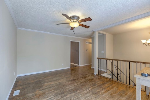 16100 E Elm St, Independence, MO 64050 - empty room featuring a chandelier, wood finished floors, ceiling fan, a textured ceiling, and ornamental molding