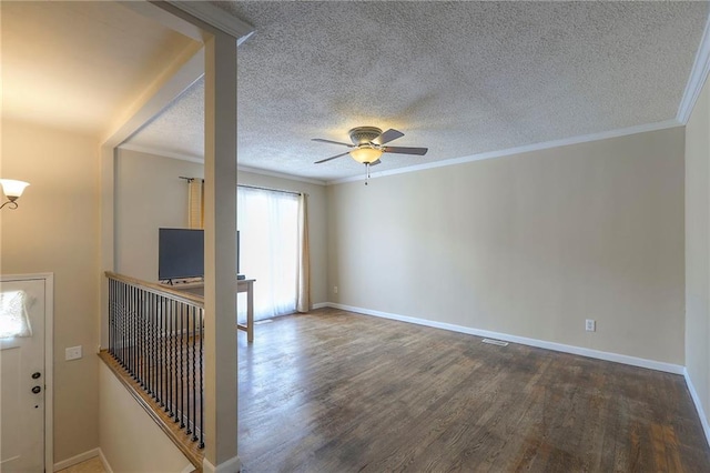16100 E Elm St, Independence, MO 64050 - spare room featuring wood finished floors, ceiling fan, ornamental molding, and a textured ceiling