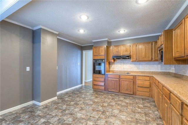 16100 E Elm St, Independence, MO 64050 - kitchen with under cabinet range hood, black appliances, tasteful backsplash, light countertops, and crown molding