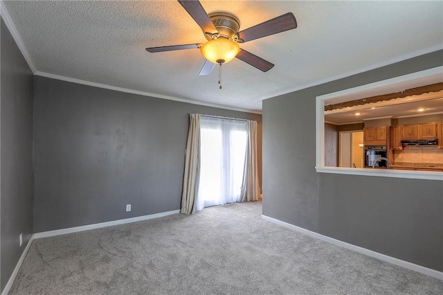 16100 E Elm St, Independence, MO 64050 - unfurnished living room featuring crown molding, light colored carpet, a ceiling fan, and a textured ceiling