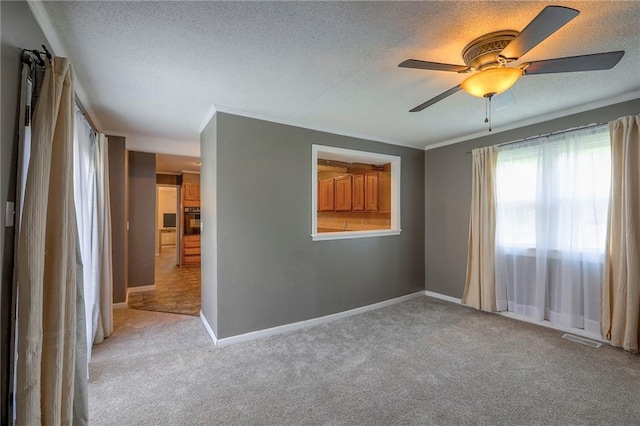 16100 E Elm St, Independence, MO 64050 - empty room featuring light colored carpet, a textured ceiling, ceiling fan, and crown molding