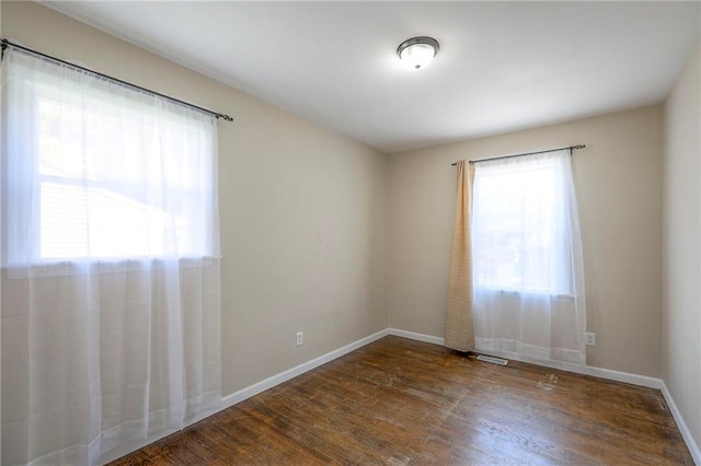 16100 E Elm St, Independence, MO 64050 - unfurnished room with healthy amount of natural light and wood finished floors