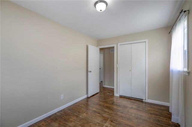 16100 E Elm St, Independence, MO 64050 - unfurnished bedroom with wood finished floors and a closet