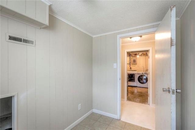 16100 E Elm St, Independence, MO 64050 - laundry room featuring separate washer and dryer, crown molding, a textured ceiling, and light tile patterned flooring