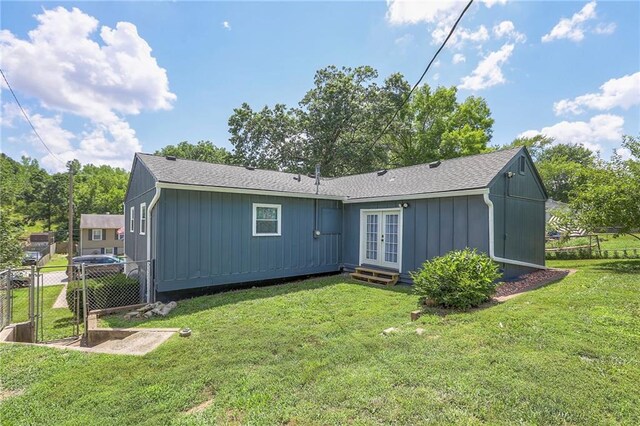 16100 E Elm St, Independence, MO 64050 - back of house with french doors, a gate, and board and batten siding