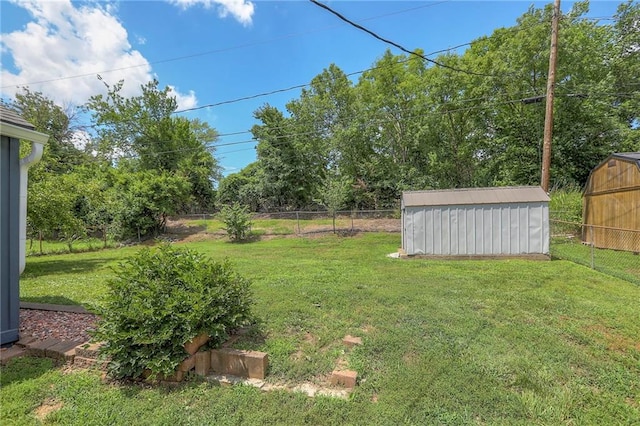 16100 E Elm St, Independence, MO 64050 - fenced backyard featuring a shed and view of scattered trees