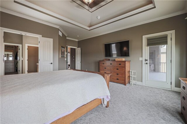 1217 Kingsland Cir, Raymore, MO 64083 - carpeted bedroom featuring a raised ceiling and crown molding