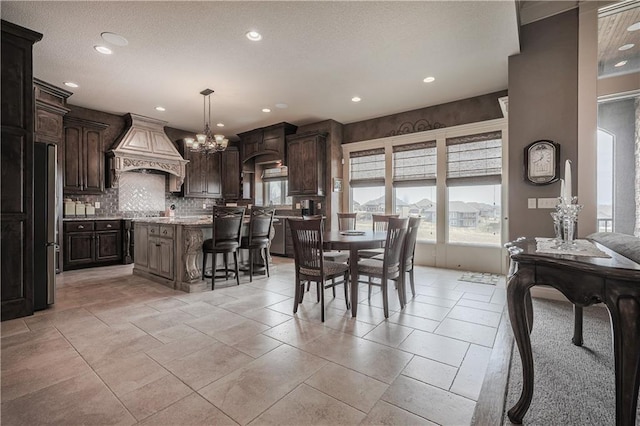 1217 Kingsland Cir, Raymore, MO 64083 - dining space featuring plenty of natural light, a chandelier, and recessed lighting