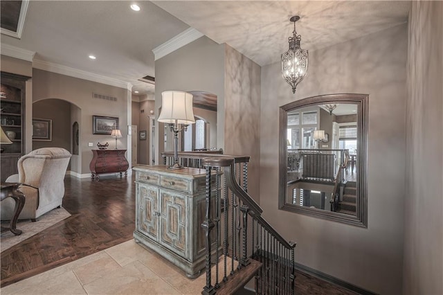 1217 Kingsland Cir, Raymore, MO 64083 - corridor featuring arched walkways, a chandelier, ornamental molding, recessed lighting, and an upstairs landing