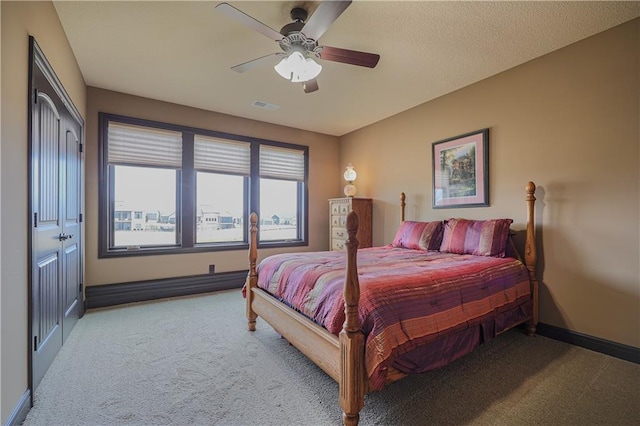 1217 Kingsland Cir, Raymore, MO 64083 - carpeted bedroom featuring baseboards and a ceiling fan