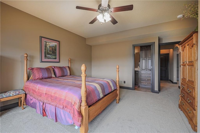 1217 Kingsland Cir, Raymore, MO 64083 - bedroom featuring light carpet, ceiling fan, and connected bathroom