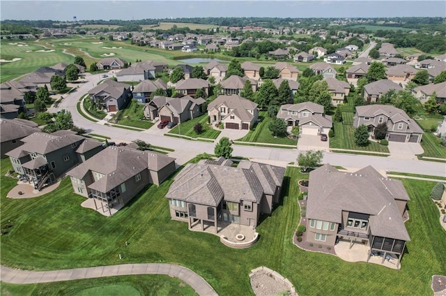 1217 Kingsland Cir, Raymore, MO 64083 - aerial perspective of suburban area with a golf course and a nearby body of water