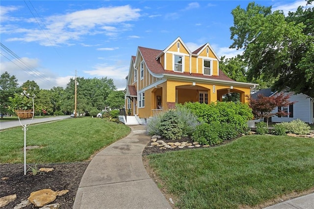 533 S Water St, Olathe, KS 66061 - view of front of house featuring stucco siding, a porch, and a front yard