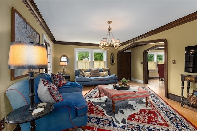 533 S Water St, Olathe, KS 66061 - living area with a chandelier, wood finished floors, plenty of natural light, and ornamental molding